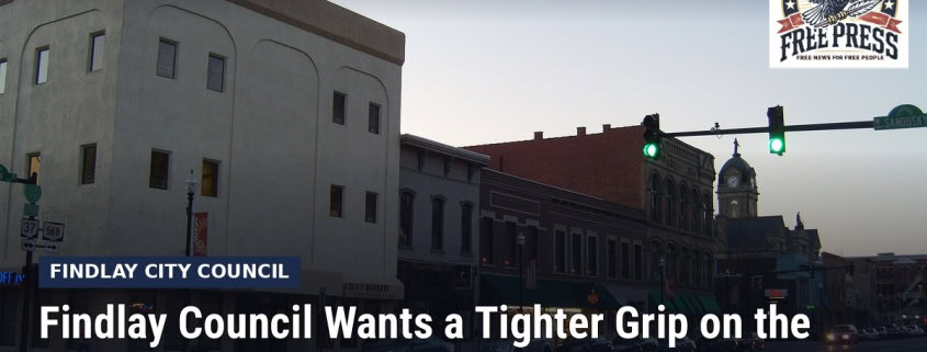 Fostoria News: Downtown Findlay buildings, with headline: Findlay Council Wants a Tighter Grip on the City Budget